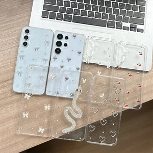 Cute clear phone case with 3D silver butterfly and snake charms on a wooden desk