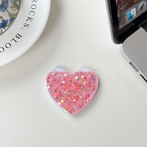 Pink heart-shaped glitter phone grip mirror detail with sparkling sequins and foldable design
