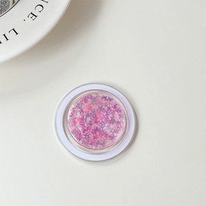 Detail of round phone socket featuring sparkling purple and pink butterfly sequins