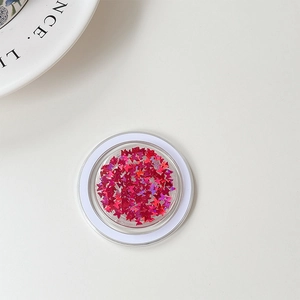 Macro view of butterfly sequins in a clear round jar with shimmering laser finish
