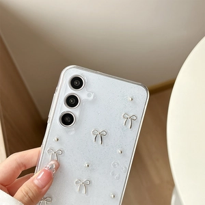 Detail of glitter phone case for Samsung with silver 3D bows and metallic accents