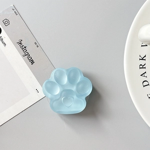 Detail of light blue cat paw phone socket with heart shape and matte finish texture