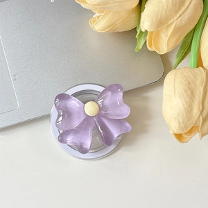 Détail du support de téléphone magnétique en forme de nœud violet en acrylique