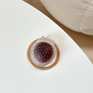 Macro detail of a 3D strawberry magnetic phone socket with frosted gradient finish