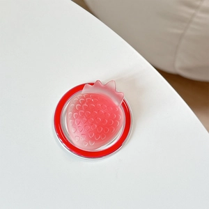 Detail of 3D pink strawberry MagSafe grip with translucent finish and red base
