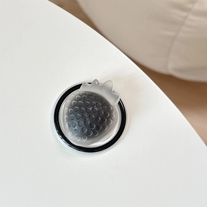 Macro detail of translucent gray 3D strawberry phone grip with matte finish and grain texture