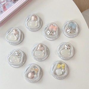 Magnetic folding phone stand with cute resin hearts and pearls on white background