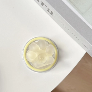Close-up of translucent cat paw MagSafe phone holder with 3D heart-shaped paw detail