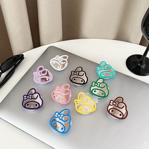 Cute bunny mirror phone socket stand set in multiple colors on a laptop surface