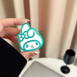 Close-up of My Melody character phone grip holder in white and mint green silicone