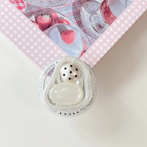 Detail of pearl resin phone socket with Gift For You text and cute decorative accents