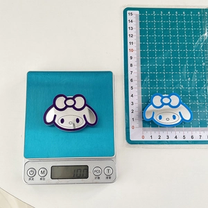 Macro view of My Melody cartoon mirror grip accessory showing weight of 10.0g and 5cm size