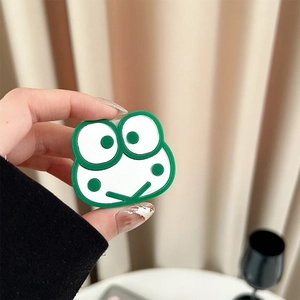 Detail of Keroppi frog cartoon phone grip holder featuring a green acrylic finish