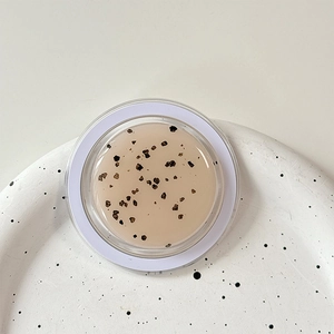 Macro detail of glitter magnetic phone holder featuring a smooth shimmering surface