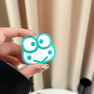 Detail of mint green frog-shaped phone socket mirror with smooth silicone edges
