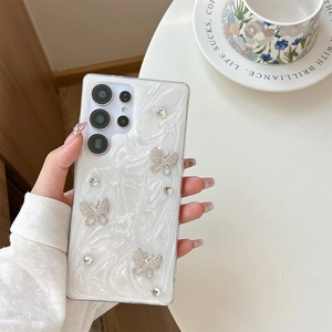Detail of luxury white marble phone case for Samsung S25 Ultra with diamond butterflies