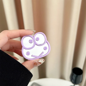 Macro detail of cartoon frog mirror phone grip holder with purple foldable airbag stand