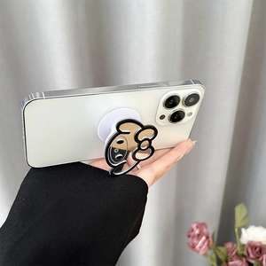 Close-up of the cartoon mirror phone socket with black bow design on a white phone
