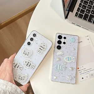 Detail of glitter phone case with 3D marine charms like fish and stars for Samsung