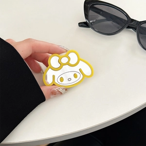 Detail of My Melody cartoon mirror phone grip with yellow border and silver finish