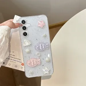 Sparkly clear Samsung S25 Ultra case with 3D resin fish, stars, and glitter finish