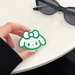 Detail of My Melody shaped green mirror phone grip holder with glossy finish