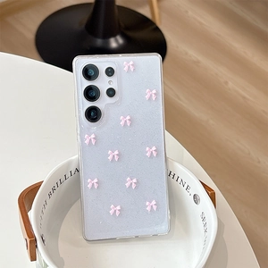Detail of silver glitter Samsung S25 Ultra case with pink 3D ribbon bow decorations