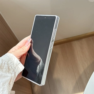 Detail of transparent glitter phone case with precise cutouts held in hand for Samsung