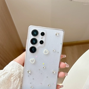 Detail of glitter phone case with pearl heart and silver butterfly for Samsung S24
