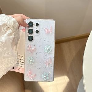 Detail view of Samsung S22 Ultra case with glitter, 3D pink butterflies and blue flowers