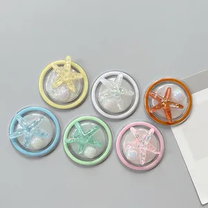 Glitter starfish phone socket stands in macaron colors including pink and blue