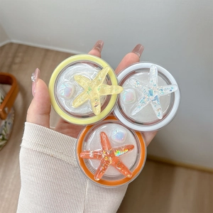 Sparkly starfish glitter phone socket grips in yellow, white and coral colors