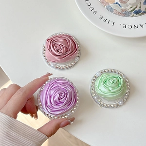 Elegant fabric camellia phone socket with rhinestones in pink, purple, and green colors