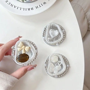 Luxe pearl and rhinestone phone sockets with heart and butterfly motifs in a chic set