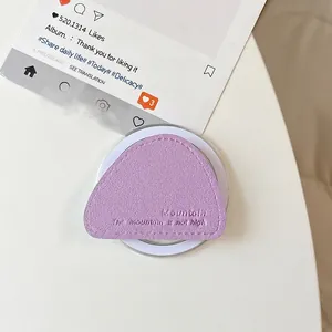 Detailed view of lavender leather magnetic phone grip with mountain theme embossing