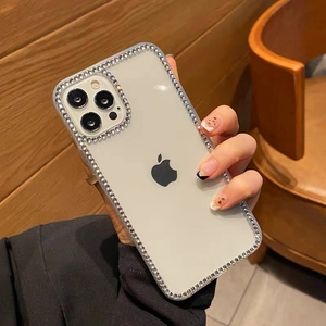 Luxury clear iPhone case with sparkly rhinestones around the camera and edges for women