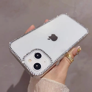 Detailed view of luxury rhinestone embellishments on a clear protective iPhone case