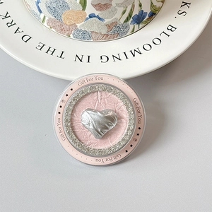 Detail of silver metallic heart phone grip with rhinestones and Gift For You text