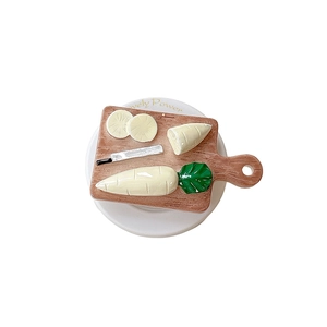 Creative cutting board phone grip featuring radish and knife miniature kitchen design