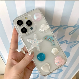 Coque iPhone transparente avec charmes 3D thème marin, étoiles de mer et dauphins