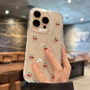 Glitter cherry stars clear phone case for iPhone 16 Pro Max shown in hand