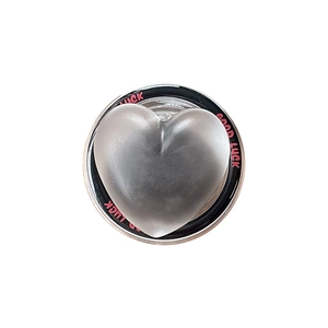 Silver metallic heart phone grip with Good Luck text on a black base on white background