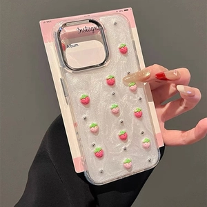 Detailed close-up of glitter iPhone case with 3D strawberry charms and Instagram-style card