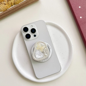 Elegant butterfly phone grip stand with yellow crystal and pearls on white smartphone