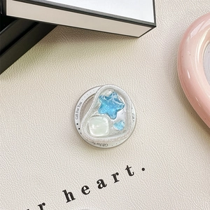 Detail of blue starfish and heart mobile phone stand with Gift For You branding