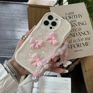 Cream white wavy iPhone case with 3D pink bows, laser glitter sequins and beaded lanyard
