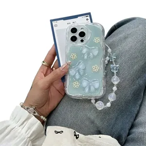 Blue glitter iPhone case with 3D bows, pearl flowers and a matching beaded charm strap