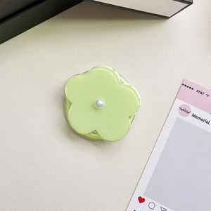 Green flower magnetic phone grip with pearl accent and retractable stand on leather base