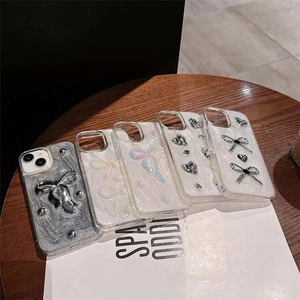 Luxury iPhone case with silver bow, pearls and glitter texture on stylish wooden table