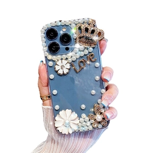 Luxury Samsung S24 Ultra clear case with white pearls, crystal crown and golden Love charms
